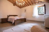 A bed or beds in a room at Agriturismo Poggio Nardini