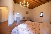 A bed or beds in a room at Agriturismo Poggio Nardini