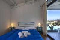 Posteľ alebo postele v izbe v ubytovaní Villa a Marsala con piscina