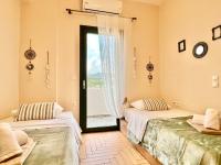 Posteľ alebo postele v izbe v ubytovaní Beach Villa Evgenia with private pool by DadoVillas