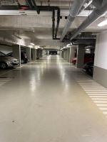 an empty parking garage with cars parked in it at Superbe Appart 2P pour 4 pers à 5 min TGV RER Orly in Massy