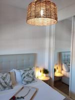 Łóżko lub łóżka w pokoju w obiekcie My Suites Madrid - Aeropuerto Ifema