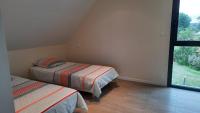 Łóżko lub łóżka w pokoju w obiekcie Pleneuf Val André Appart Vue MER 2 Chambres