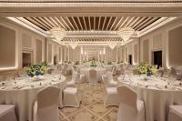 a banquet hall with white tables and white chairs at Jumeirah Mina Al Salam Dubai in Dubai