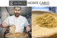 um chef está preparando um prato de macarrão em Monte Carlo Boardwalk / Oceanfront Ocean City em Ocean City