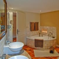 a large bathroom with a tub and a sink at Moulin De Larcy in Ribérac