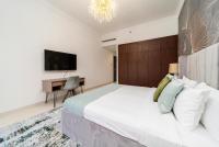 Postel nebo postele na pokoji v ubytování SIMPLY COMFORT in Sarai Palm Jumeirah