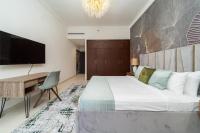 Postel nebo postele na pokoji v ubytování SIMPLY COMFORT in Sarai Palm Jumeirah