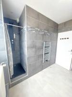 a bathroom with a shower and a glass door at Lumineux T5 en centre ville in Angoulême