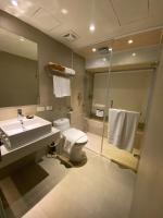 a bathroom with a sink and a toilet and a shower at Via Loft Hotel in Taipei