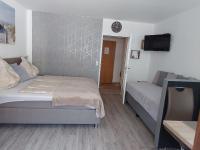 Łóżko lub łóżka w pokoju w obiekcie Appartement Daniel Kaprun