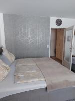 Łóżko lub łóżka w pokoju w obiekcie Appartement Daniel Kaprun