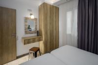 Łóżko lub łóżka w pokoju w obiekcie Semes Luxury Apts by Estia