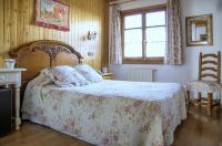 Postel nebo postele na pokoji v ubytování San Marsial Benasque Apart Hotel