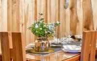 a table with a vase of flowers on top of it at Beautiful Home In Kraljev Vrh With Wifi in Kraljev Vrh
