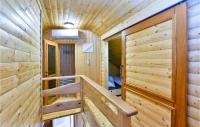 a wooden cabin with a staircase in a room at Beautiful Home In Kraljev Vrh With Wifi in Kraljev Vrh