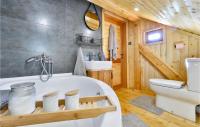 a bathroom with a tub and a sink and a toilet at Beautiful Home In Kraljev Vrh With Wifi in Kraljev Vrh