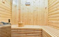 a wooden sauna with a tub and a bucket at Beautiful Home In Kraljev Vrh With Wifi in Kraljev Vrh