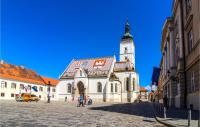 a large building with a clock tower in a street at Beautiful Home In Kraljev Vrh With Wifi in Kraljev Vrh