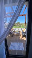 Balkón alebo terasa v ubytovaní Sunny Luxury Apartment with two great sunny - level terraces, two swimming pools, in a new complex Pueblo Majorero, close to Fuerteventura Golf Club, next to the beach , Atlantico Shopping Mall and casino in Caleta de Fuste