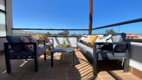 Balkón alebo terasa v ubytovaní Sunny Luxury Apartment with two great sunny - level terraces, two swimming pools, in a new complex Pueblo Majorero, close to Fuerteventura Golf Club, next to the beach , Atlantico Shopping Mall and casino in Caleta de Fuste