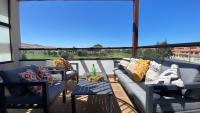 Posedenie v ubytovaní Sunny Luxury Apartment with two great sunny - level terraces, two swimming pools, in a new complex Pueblo Majorero, close to Fuerteventura Golf Club, next to the beach , Atlantico Shopping Mall and casino in Caleta de Fuste