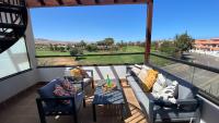 Balkón alebo terasa v ubytovaní Sunny Luxury Apartment with two great sunny - level terraces, two swimming pools, in a new complex Pueblo Majorero, close to Fuerteventura Golf Club, next to the beach , Atlantico Shopping Mall and casino in Caleta de Fuste