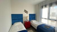 Posteľ alebo postele v izbe v ubytovaní Sunny Luxury Apartment with two great sunny - level terraces, two swimming pools, in a new complex Pueblo Majorero, close to Fuerteventura Golf Club, next to the beach , Atlantico Shopping Mall and casino in Caleta de Fuste