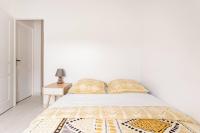 Łóżko lub łóżka w pokoju w obiekcie Joli appartement proche Paris Orly - Climatisé