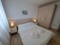 Postel nebo postele na pokoji v ubytování Apartments Fran