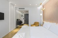 Posteľ alebo postele v izbe v ubytovaní Acropolis Magenta Luxury Suites