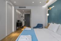 Posteľ alebo postele v izbe v ubytovaní Acropolis Magenta Luxury Suites