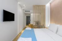 Posteľ alebo postele v izbe v ubytovaní Acropolis Magenta Luxury Suites