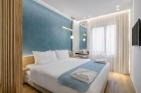 Posteľ alebo postele v izbe v ubytovaní Acropolis Magenta Luxury Suites