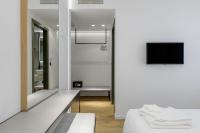 Posteľ alebo postele v izbe v ubytovaní Acropolis Magenta Luxury Suites