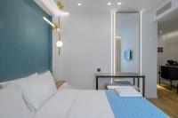 Posteľ alebo postele v izbe v ubytovaní Acropolis Magenta Luxury Suites