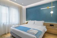 Posteľ alebo postele v izbe v ubytovaní Acropolis Magenta Luxury Suites