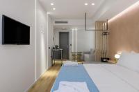 Posteľ alebo postele v izbe v ubytovaní Acropolis Magenta Luxury Suites
