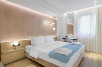 Posteľ alebo postele v izbe v ubytovaní Acropolis Magenta Luxury Suites