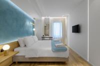 Posteľ alebo postele v izbe v ubytovaní Acropolis Magenta Luxury Suites