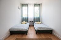 Łóżko lub łóżka w pokoju w obiekcie *Le Cosy* 3 chambres hypercentre - Parking - Wifi