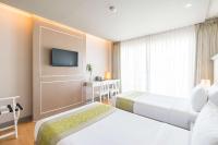 Postel nebo postele na pokoji v ubytování Best Western Patong Beach
