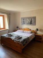 A bed or beds in a room at San Marco FARMHOUSE with a view.