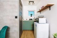 Kuchyňa alebo kuchynka v ubytovaní Loft House Rozewie - Całoroczne domki z Balią ogrodową