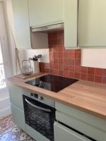 Kuchyňa alebo kuchynka v ubytovaní CasaBell Appartement atypique vintage