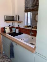 Kuchyňa alebo kuchynka v ubytovaní CasaBell Appartement atypique vintage