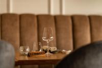 a table with two wine glasses and a reserved sign at ANC Resort in Caloura