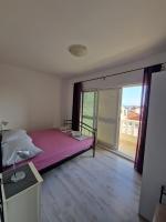 Posteľ alebo postele v izbe v ubytovaní Apartments Loris