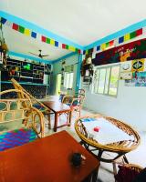 a living room with a table and chairs at Bardia Wild Side Hotel in Bhurkīā