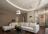 a living room with a white couch and a table at Sant&#39;Ambrogio Luxury Apartment R&amp;R in Milan